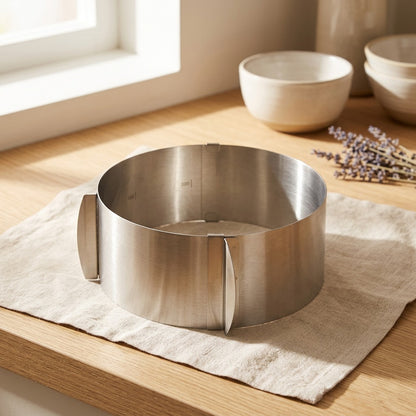 Cakebrace™ Stainless Steel Adjustable Cake Ring in a calm home setting
