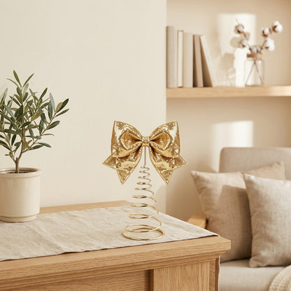 Gleambow™ Sequined Metal Christmas Bow Ornament in a calm home setting