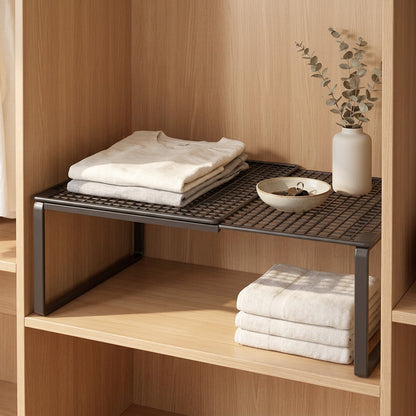 Closetrise™ Expandable Iron Wardrobe Storage Rack in a calm home setting