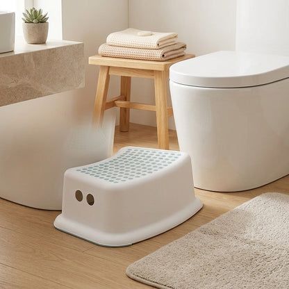 Footrest™ Plastic Toilet Stool in a calm home setting