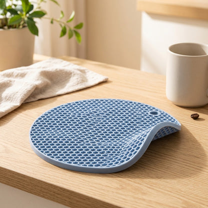 Combguard™ Round Silicone Honeycomb Insulation Mat in a calm home setting