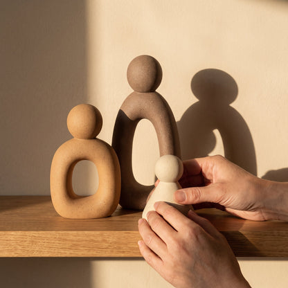 Arranging the Kin™ Family Sculpture Set as evening shadows fall