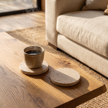 Strata™ Travertine Coasters on a live-edge oak coffee table in the Calm Eden living room