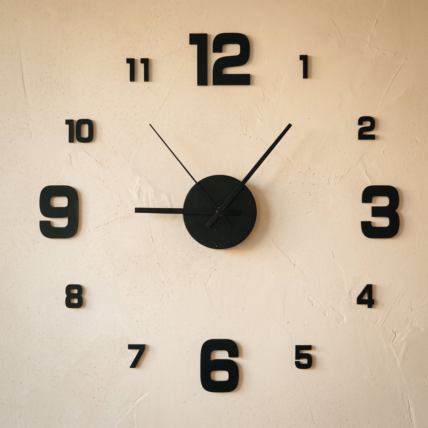 Float Clock frameless stick-on numerals and hub applied to a warm cream limewash wall