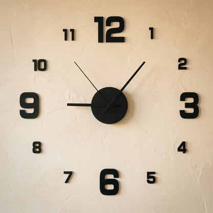 Float Clock frameless stick-on numerals and hub applied to a warm cream limewash wall