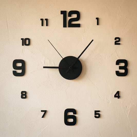 Float Clock frameless stick-on numerals and hub applied to a warm cream limewash wall
