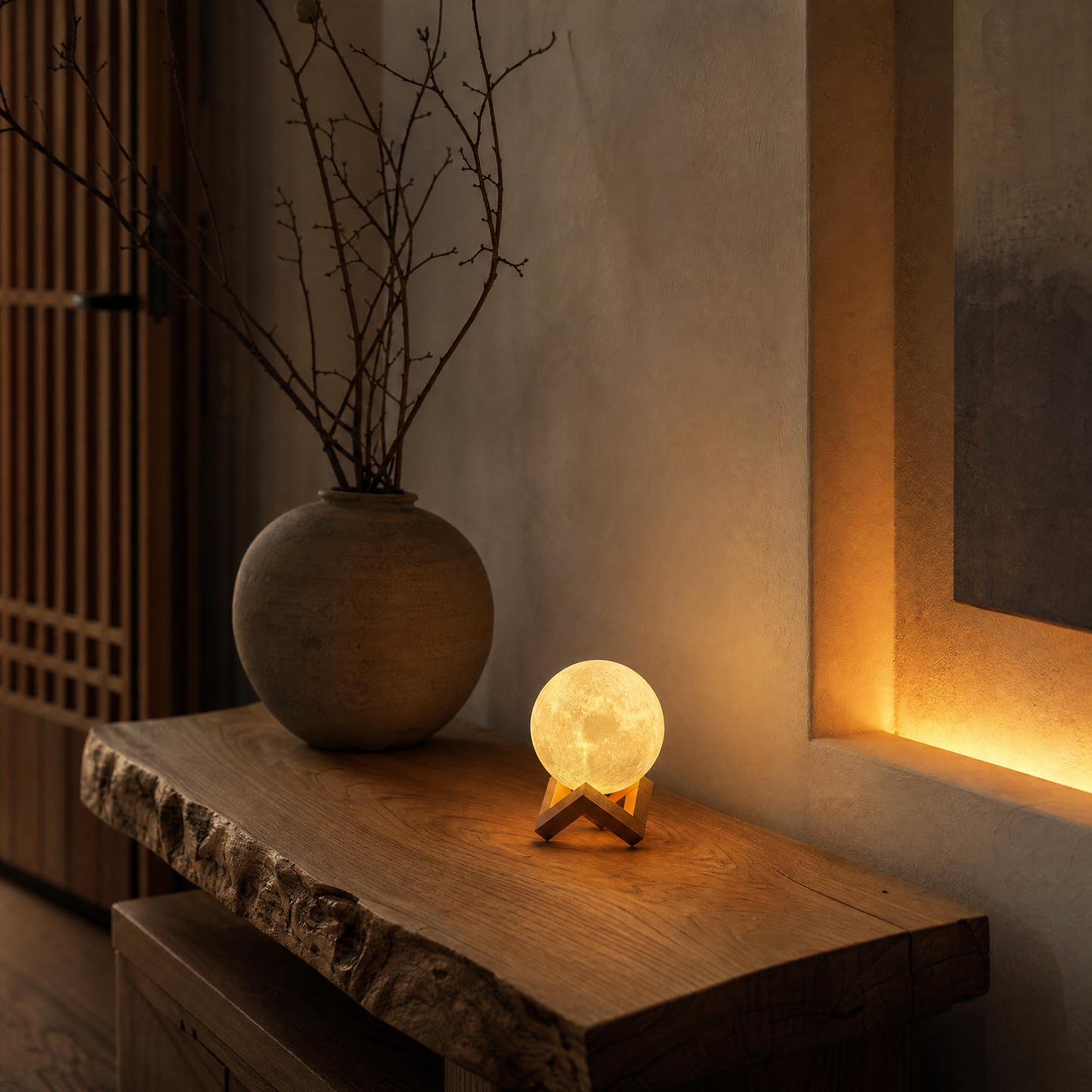 Luna moon lamp glowing on live-edge console in warm foyer at night