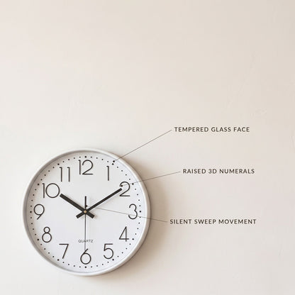 Hush Clock detail callouts: tempered glass face, raised 3D numerals, silent sweep movement