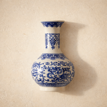 Indigo™ Porcelain Vase — blue and white flat-back wall vase on warm cream plaster