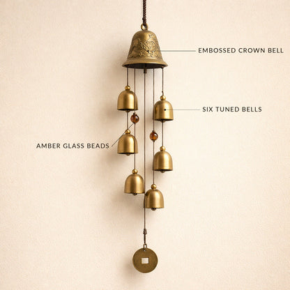 Toll™ wind chime with labelled details — embossed crown bell, six tuned bells, amber glass beads