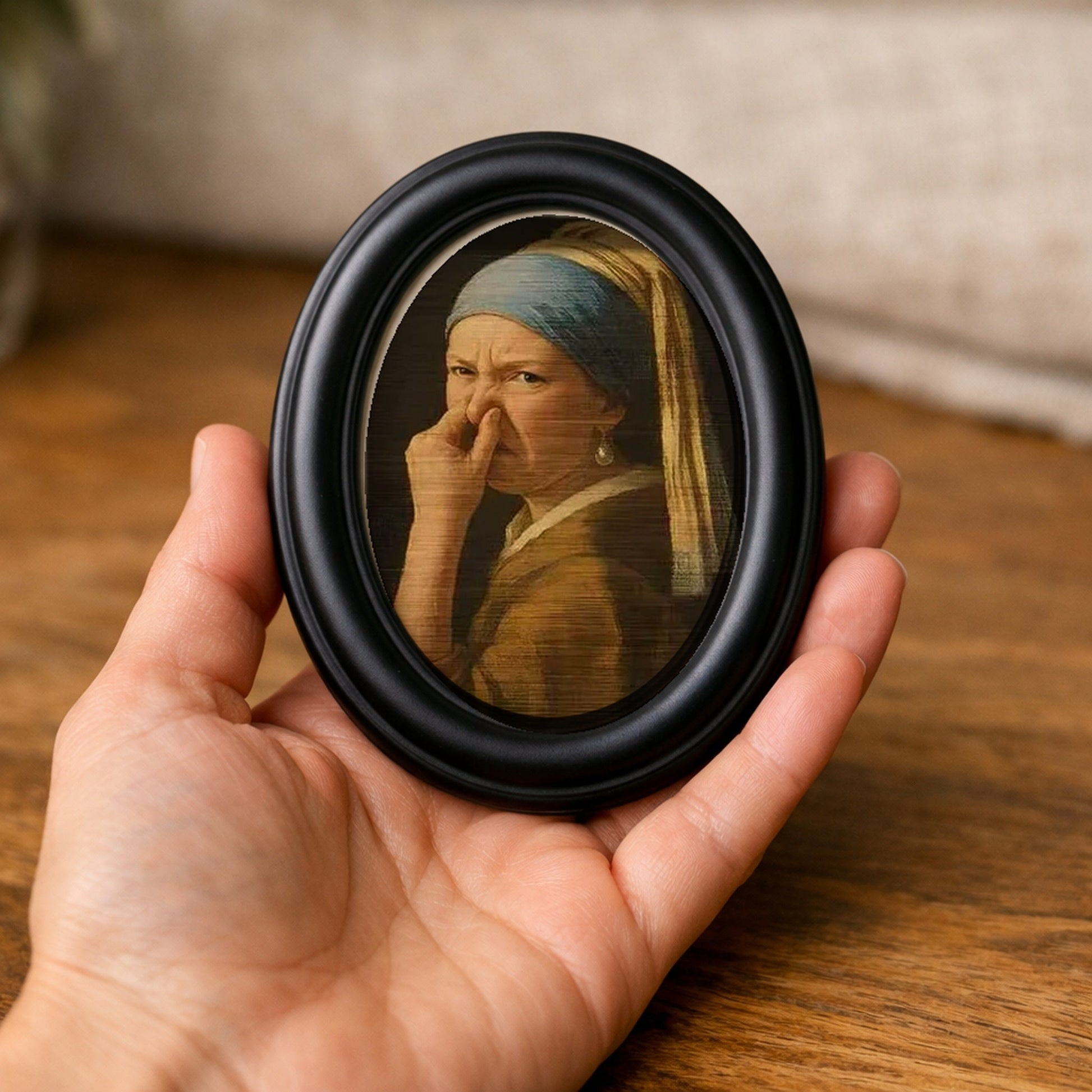Wry Mini Portrait held in an open palm, showing how small it is